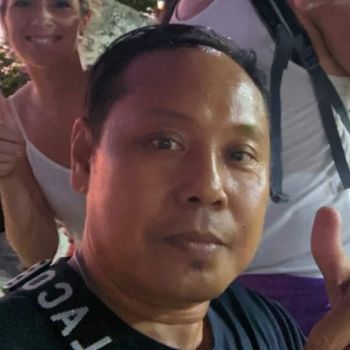Komang, Tirta Bali English-speaking driver and photographer, with guests at dusk